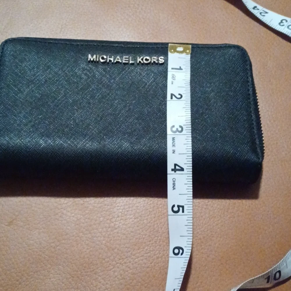 > Michael Kors Black Wristlet with Gold Accents